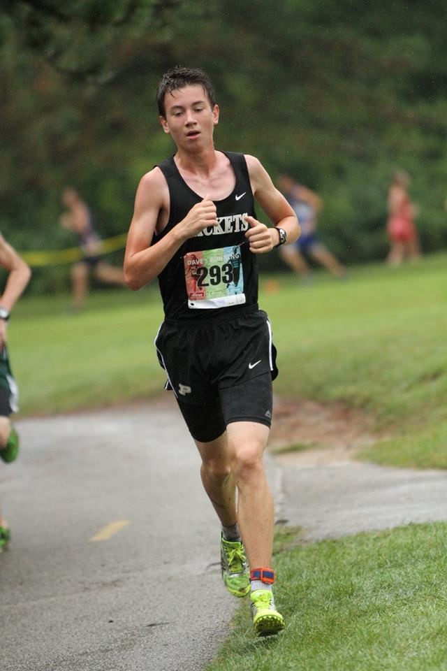 PHS boys cross country runner competing at a meet