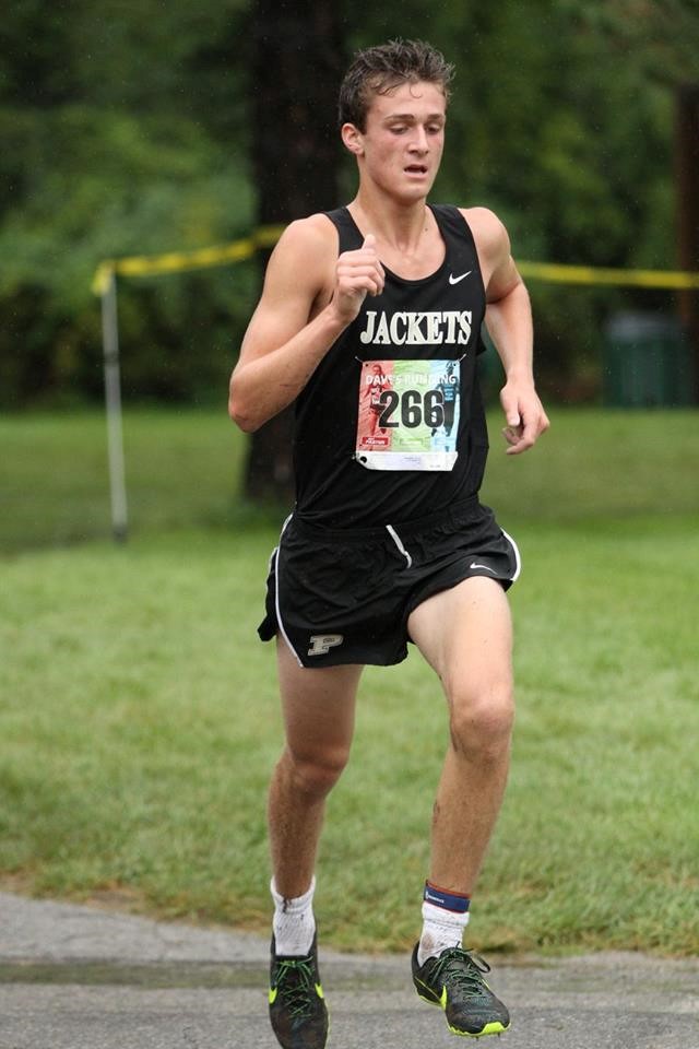 PHS boys cross country runner competing at a meet