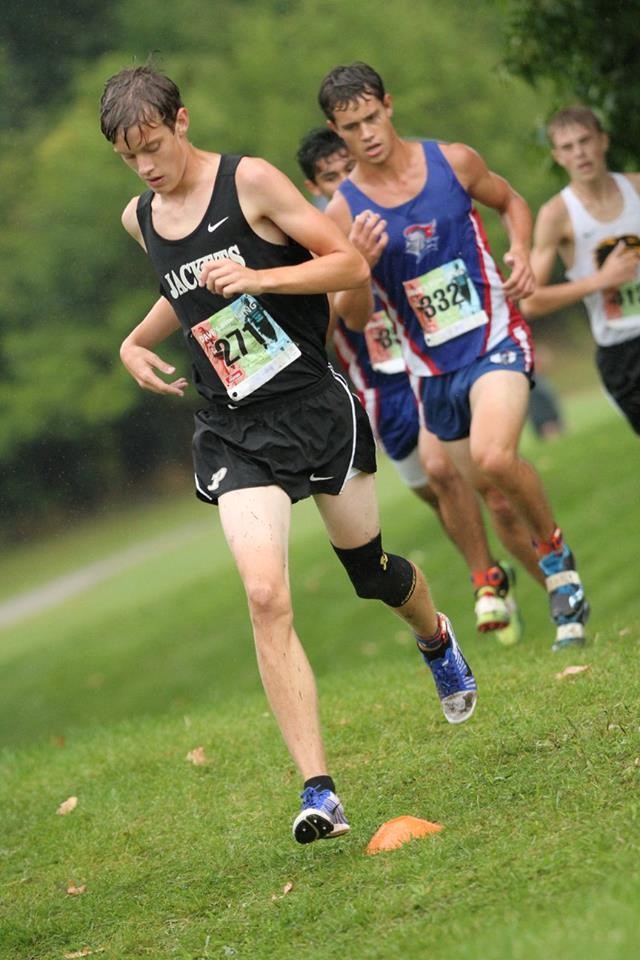 PHS boys cross country runners competing at a meet