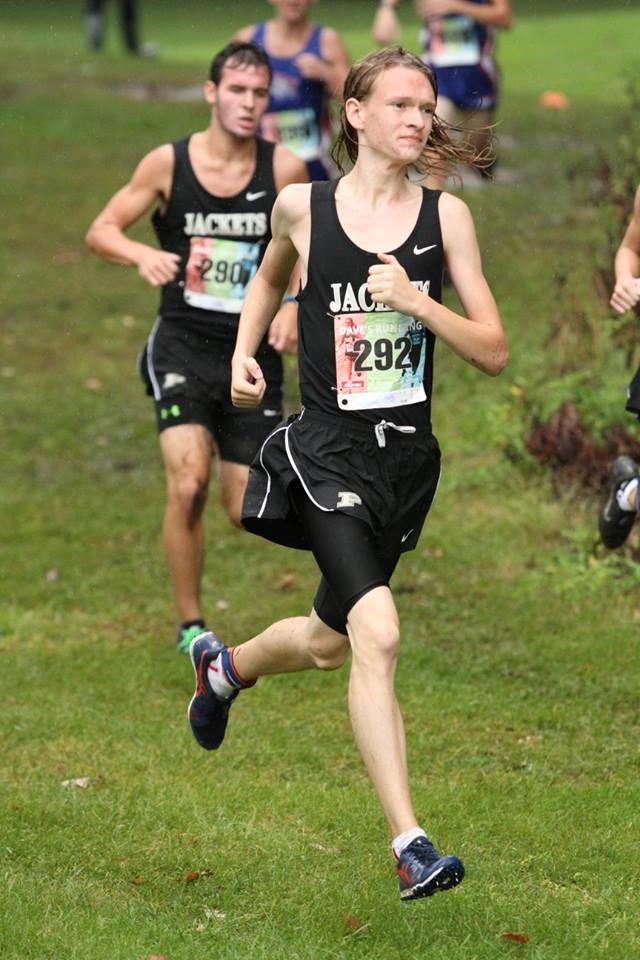 PHS boys cross country runners competing at a meet