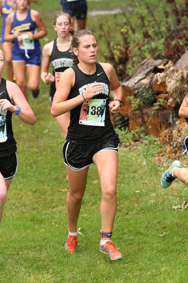 PHS girls cross country runner competing at a meet
