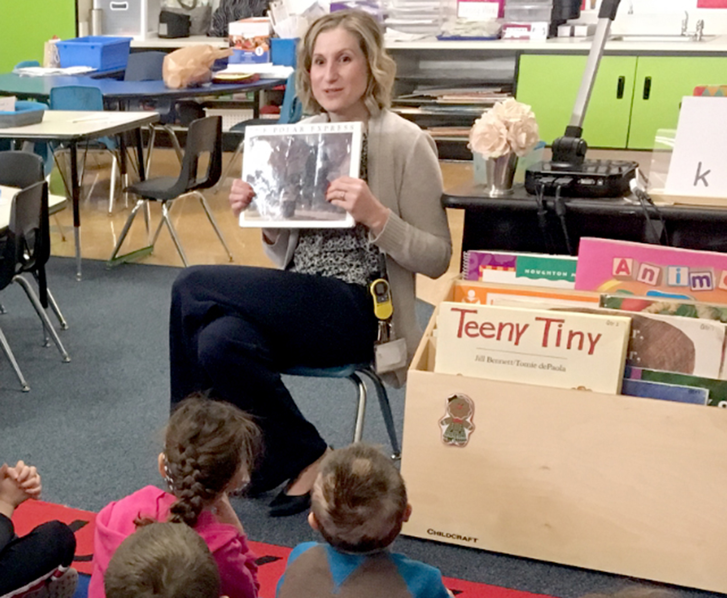 Principal Brook Price reads The Polar Express to Students