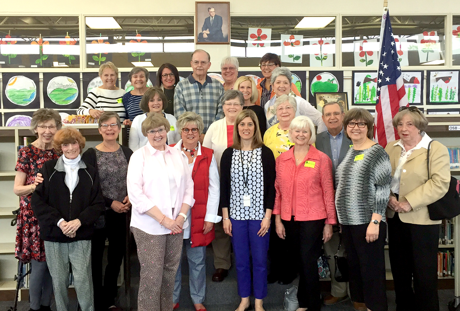 Retirees and Staff pose with Former Principal Larry Studer