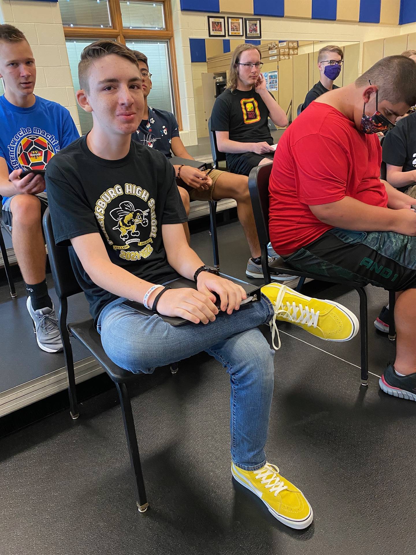 Chorale member, Ethan Vandenynde, sporting some cool yellow sneakers