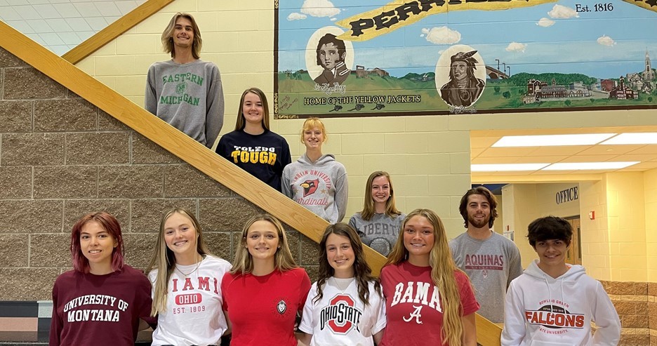 11 students in college shirts