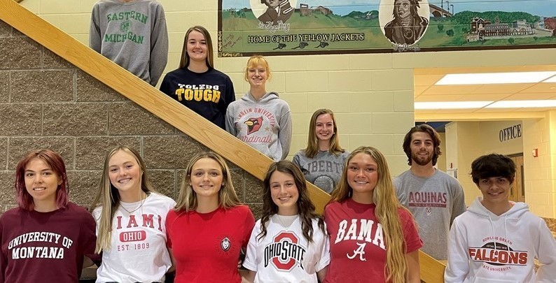 11 students in college shirts