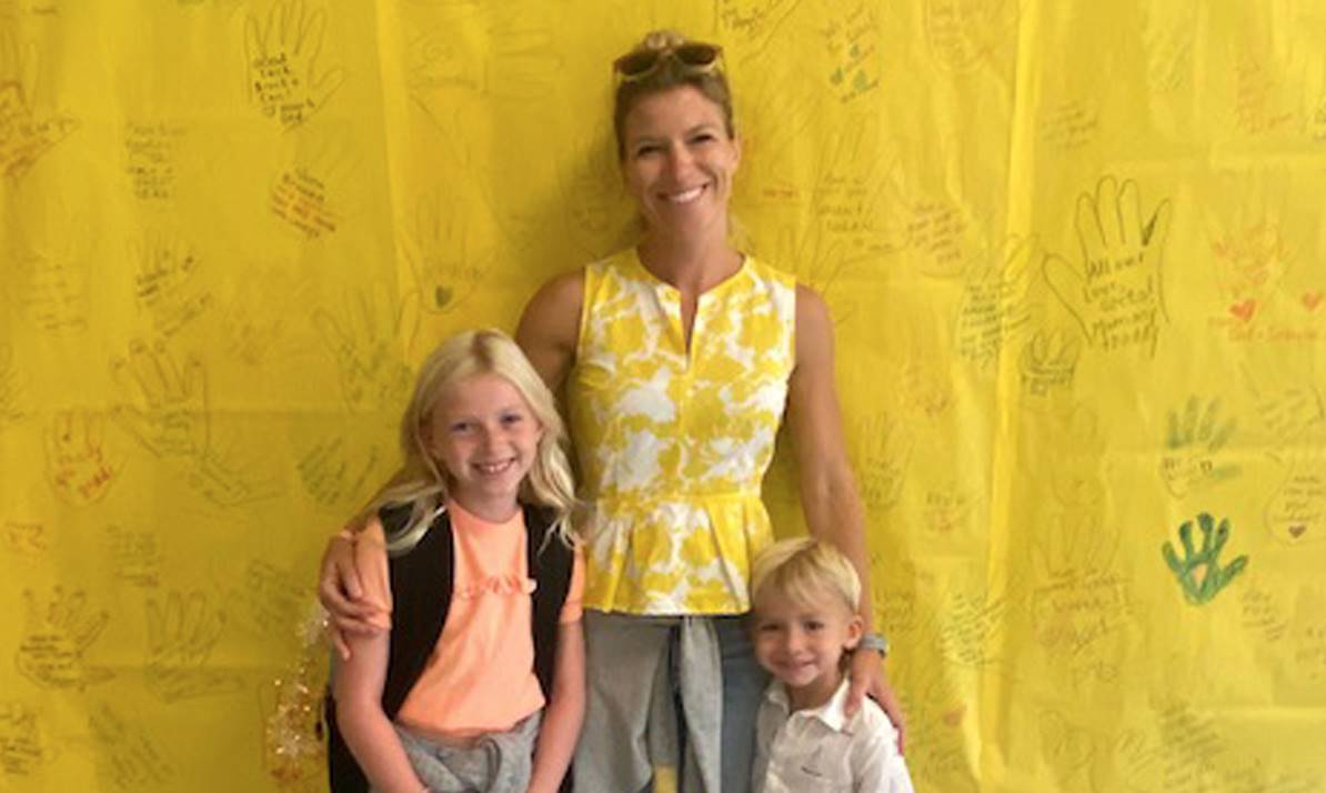 mom and two children smiling