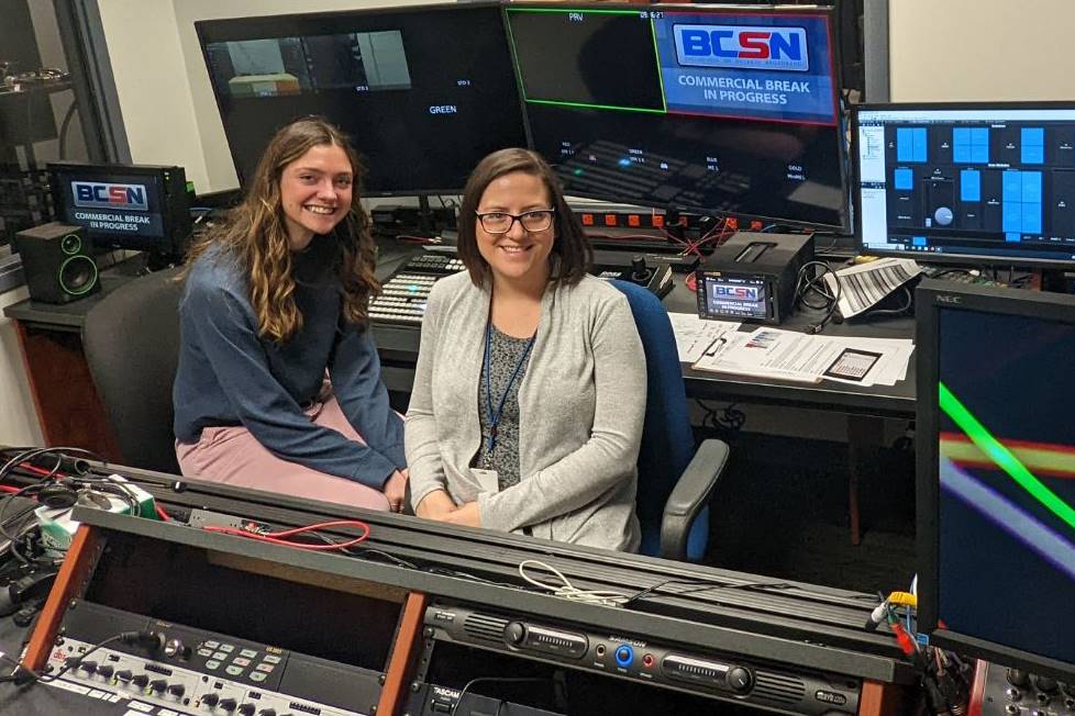 Two people in a television studio