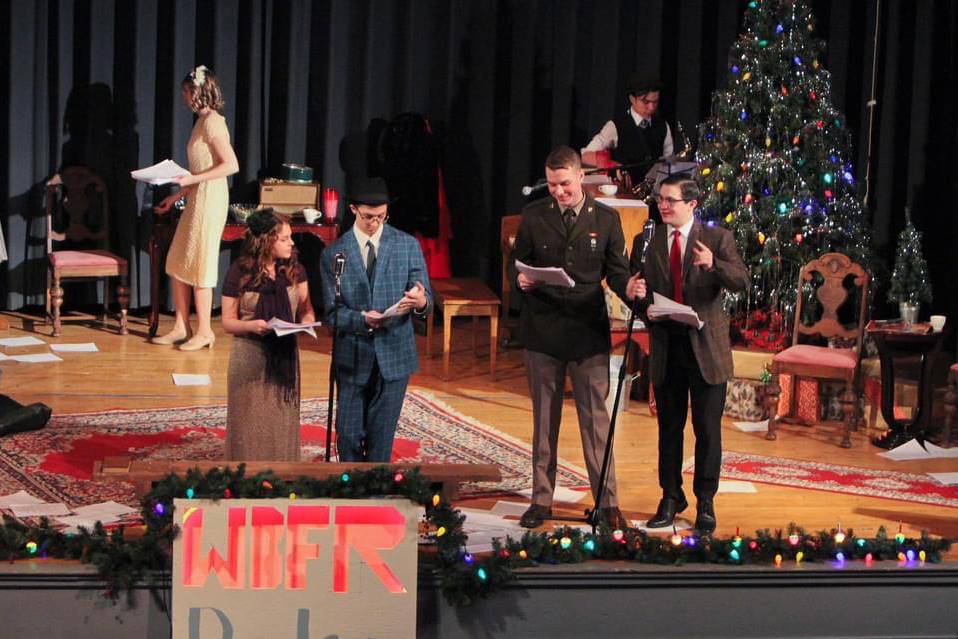 six students on stage in 50's set