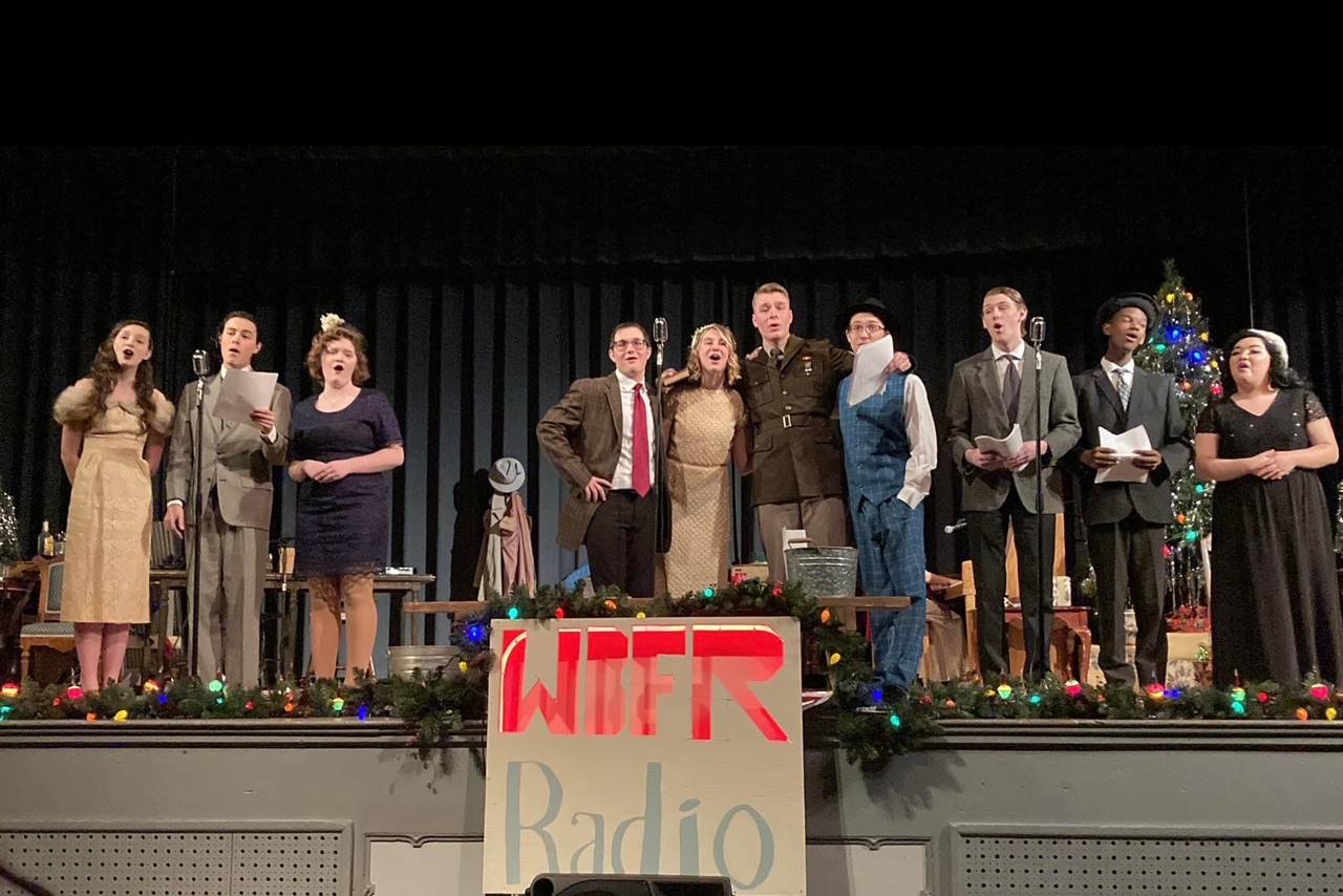 group of students on stage in 50's set