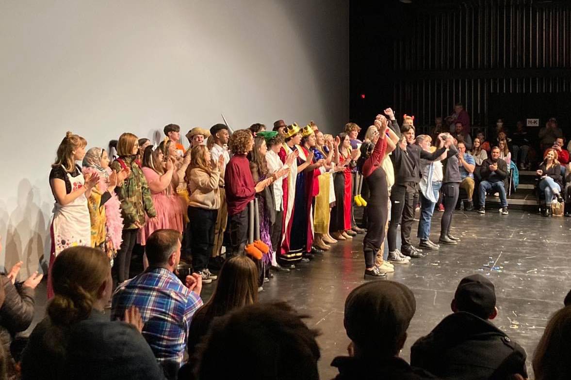 large group of students on stage