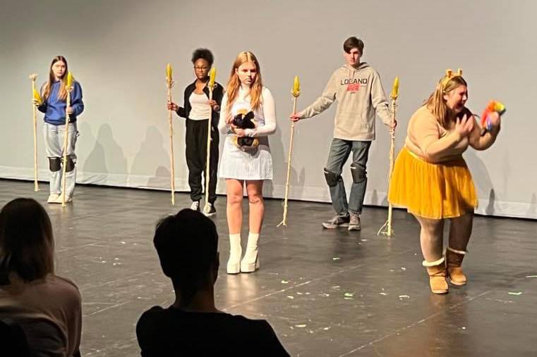 students on stage in performance