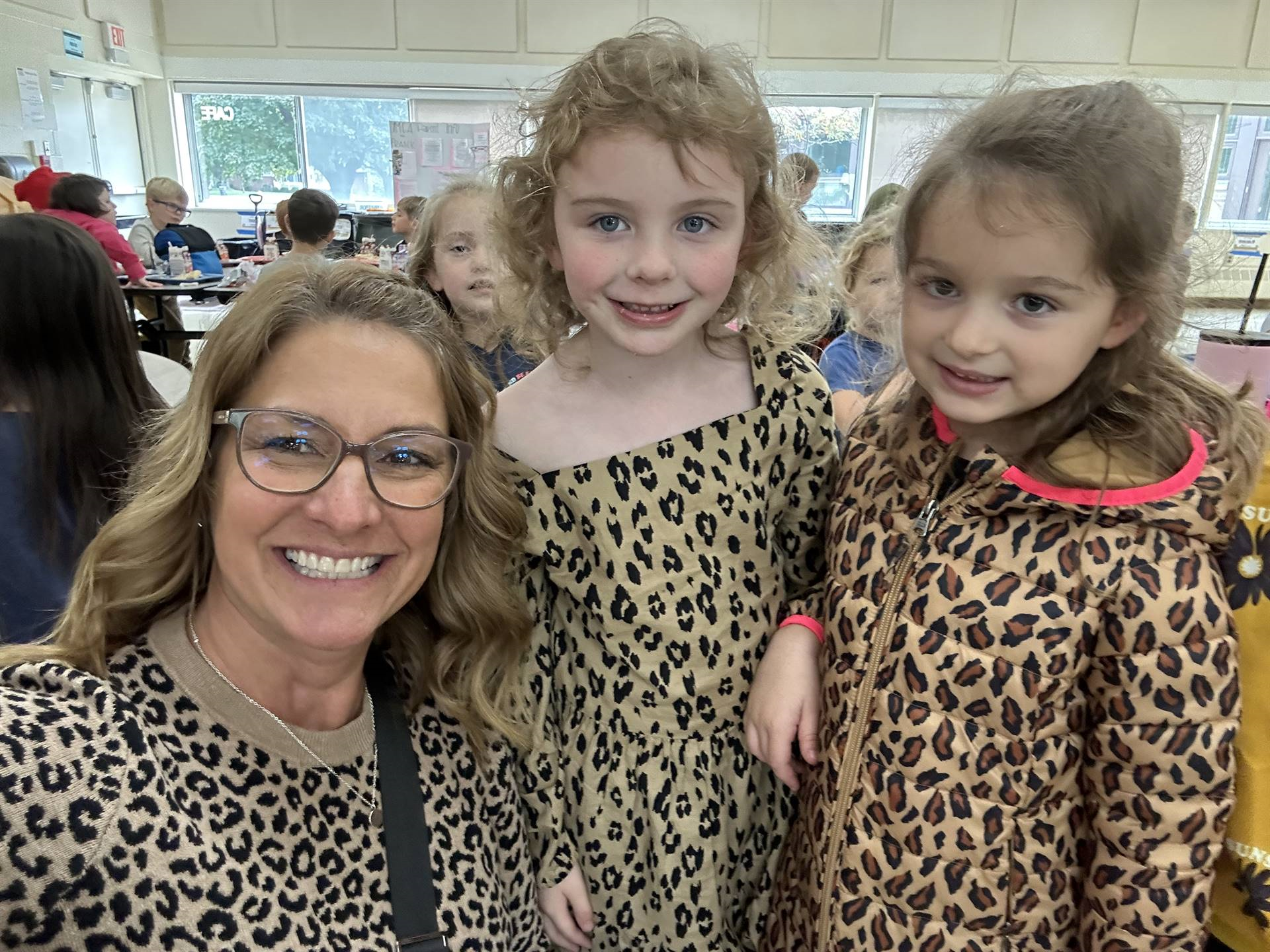 Mrs.Bryant and two students in leopard print.